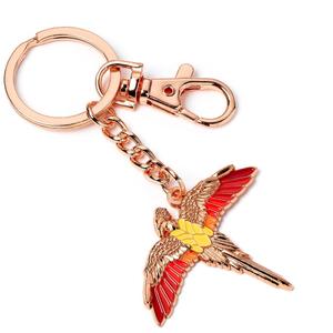 5055583444395-nyckelring-the-carat-shop-harry-potter-fawkes-guld-13-cm